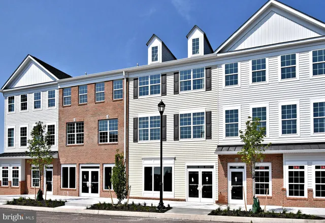 a front view of a building with a street