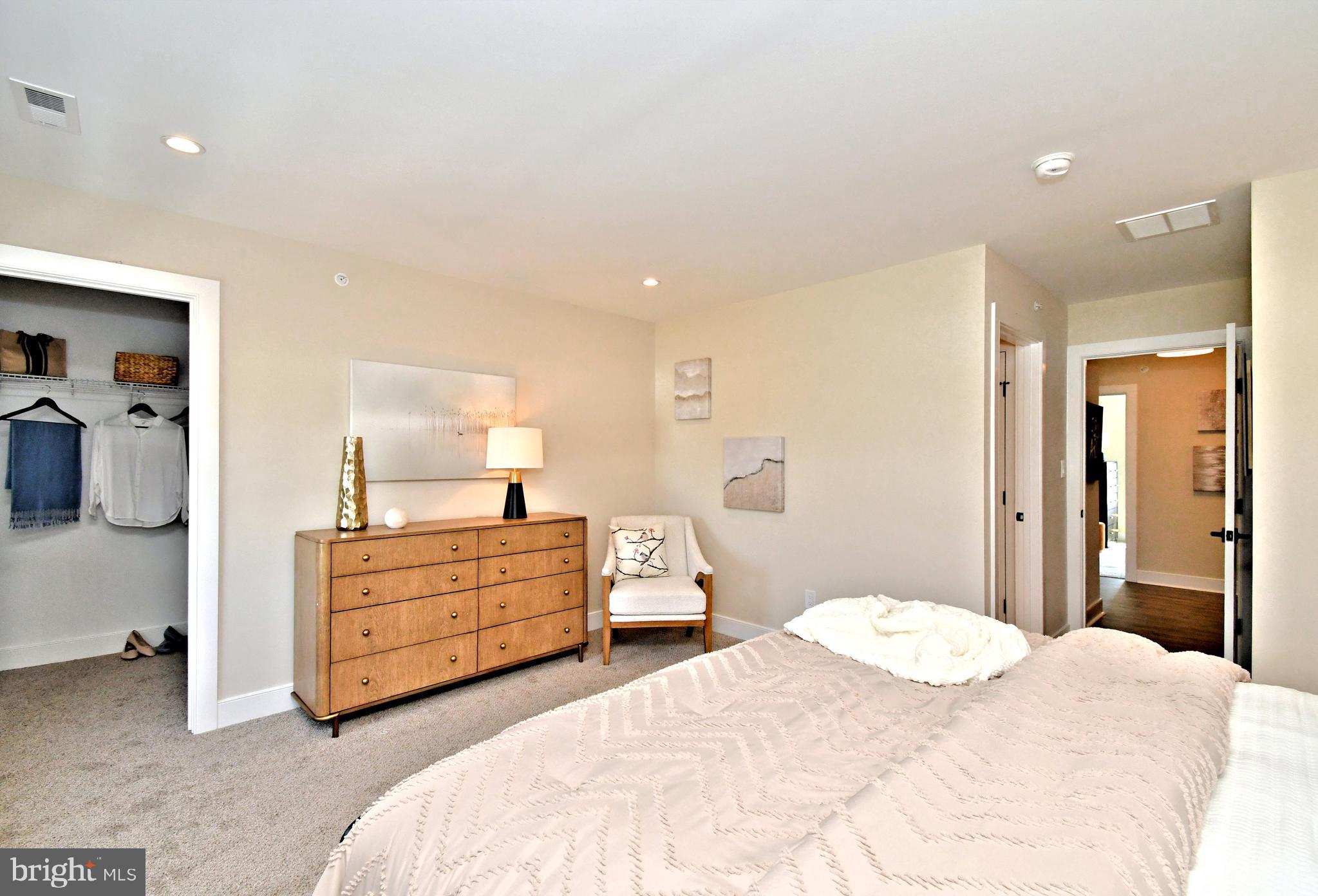 200 Souders Way Souderton, PA 18964 - Photo 26 of 50 a bedroom with a bed and a chandelier