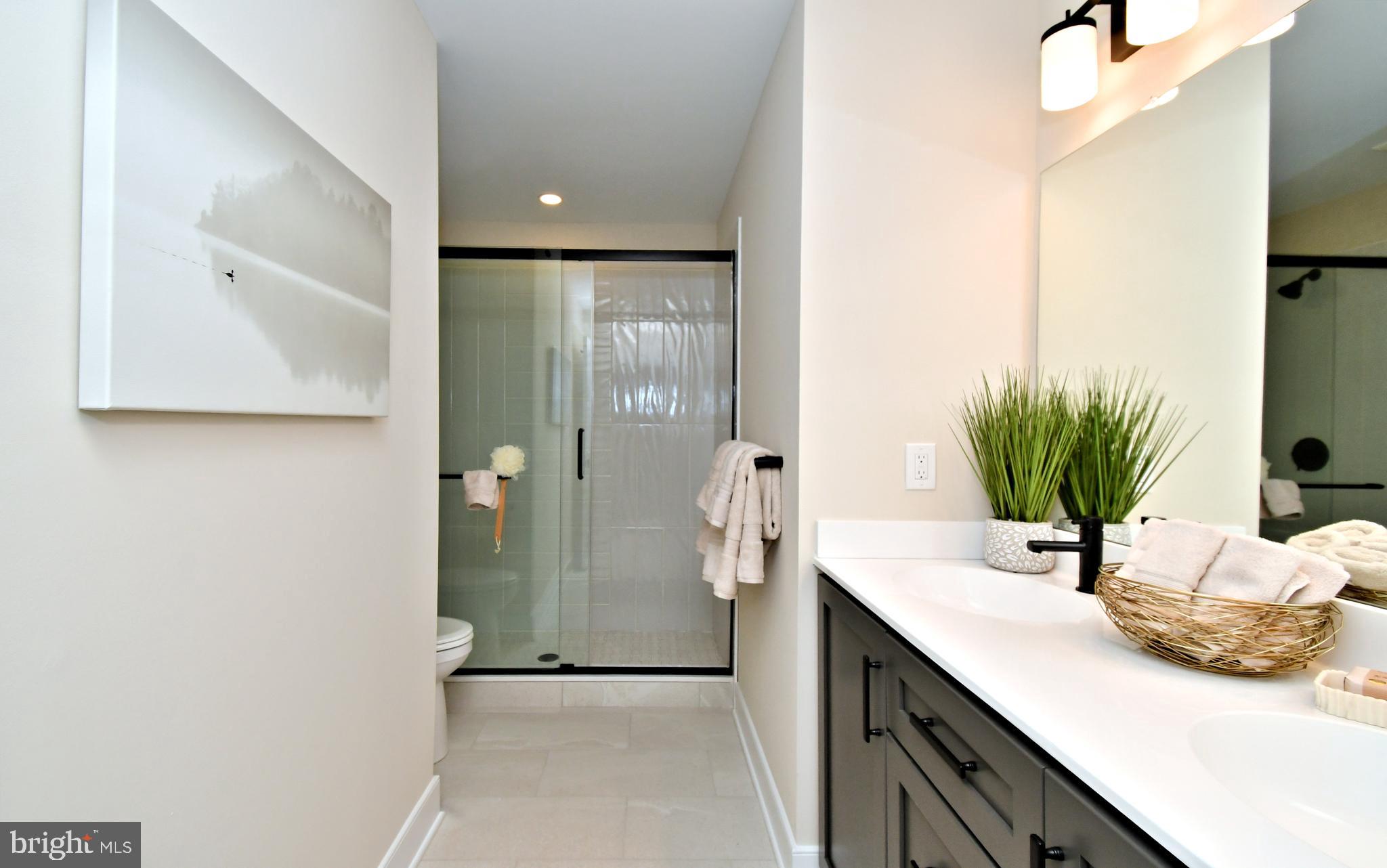 200 Souders Way Souderton, PA 18964 - Photo 31 of 50 a bathroom with a sink and a mirror