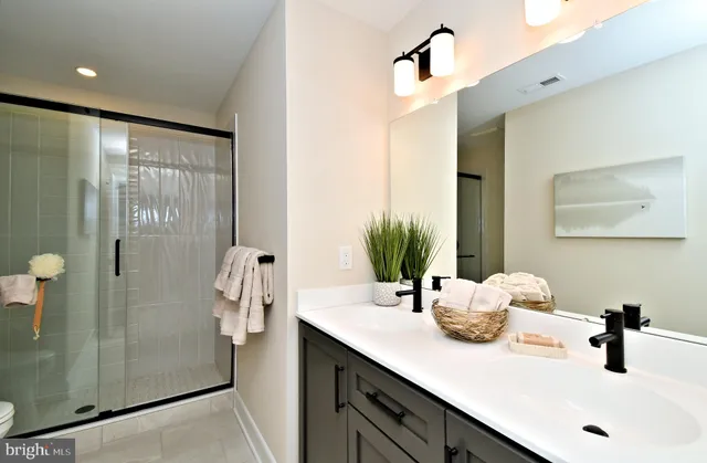 a bedroom with bed and a window