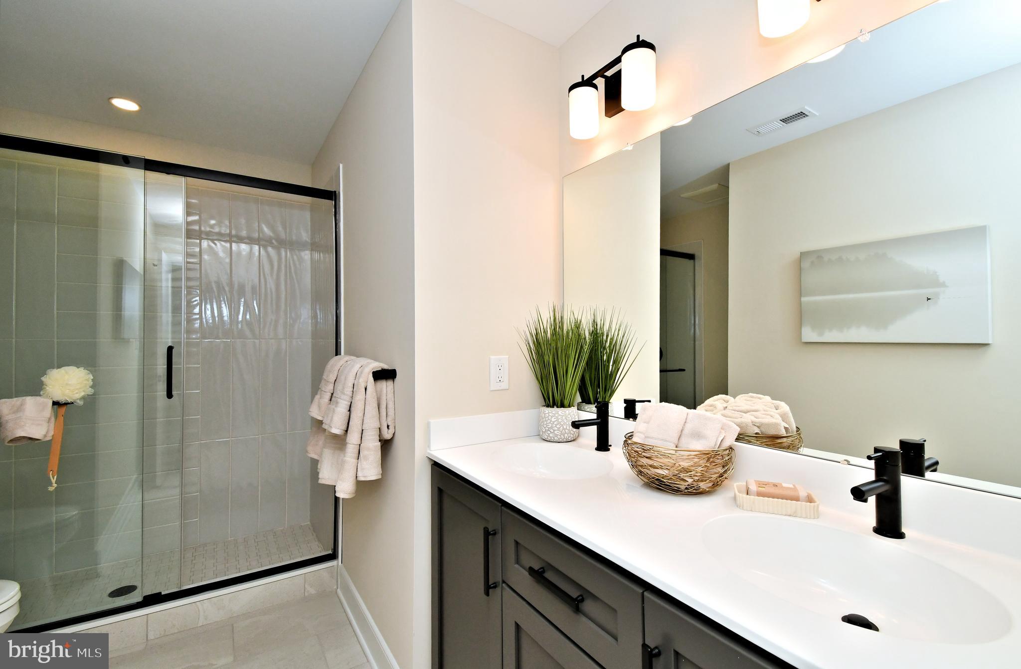 200 Souders Way Souderton, PA 18964 - Photo 32 of 50 a bathroom with a sink and a mirror