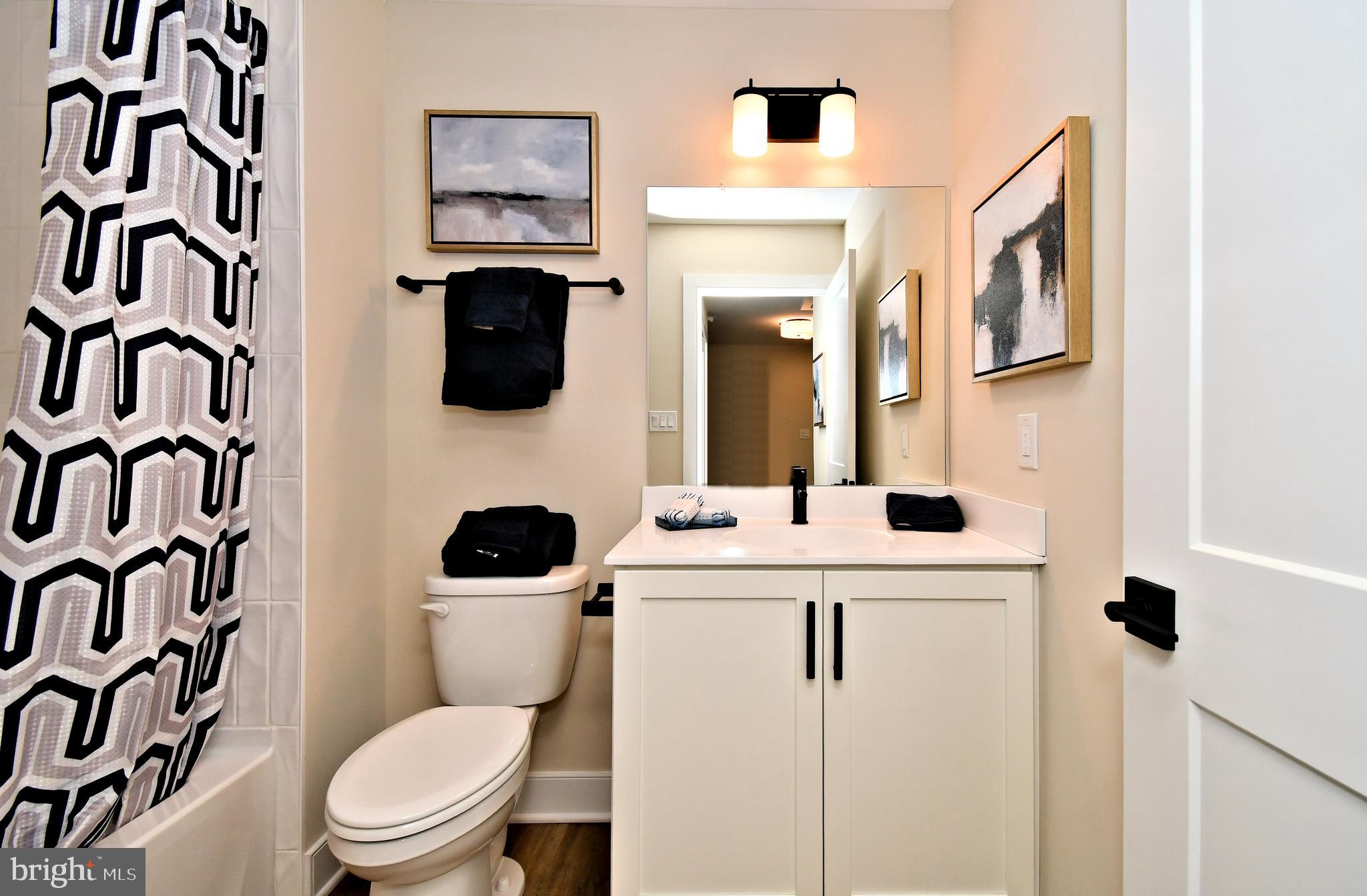 200 Souders Way Souderton, PA 18964 - Photo 39 of 50 a bathroom with a sink a toilet and a mirror