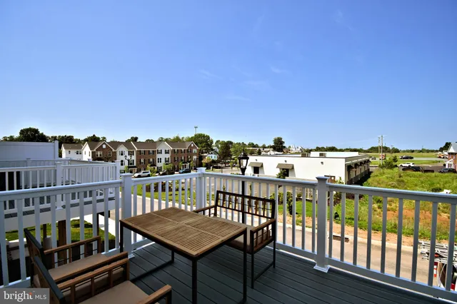 a view of a balcony with wooden floor