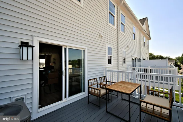 a view of a patio with a table and chairs