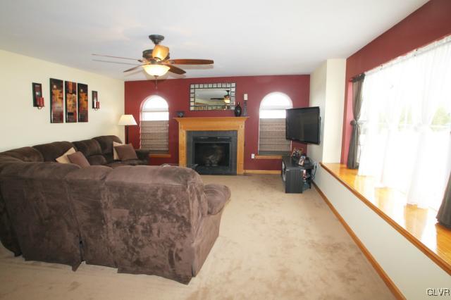 2768 Maefield Road Bath, PA 18014 - Photo 13 of 20 a living room with furniture a fireplace and a large window