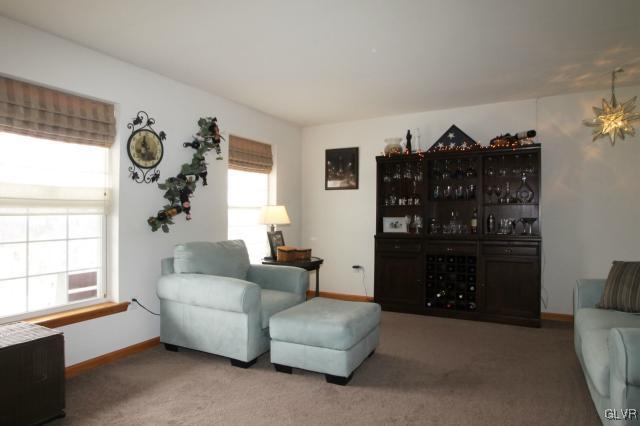 2768 Maefield Road Bath, PA 18014 - Photo 7 of 20 a living room with furniture a chandelier and a window