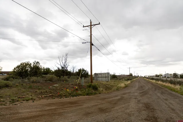 a view of a backyard with table and chairs
