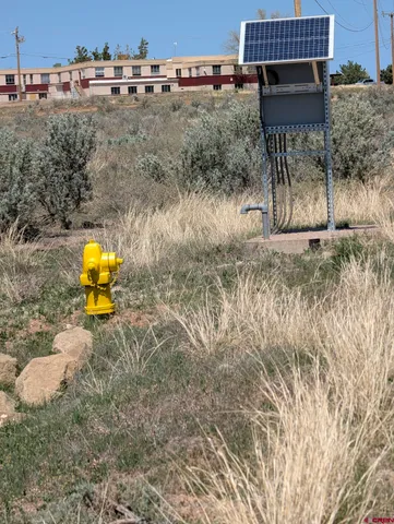 a view of ocean beach and mountain
