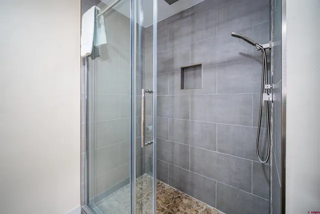 a indoor swimming pool with an outdoor seating space