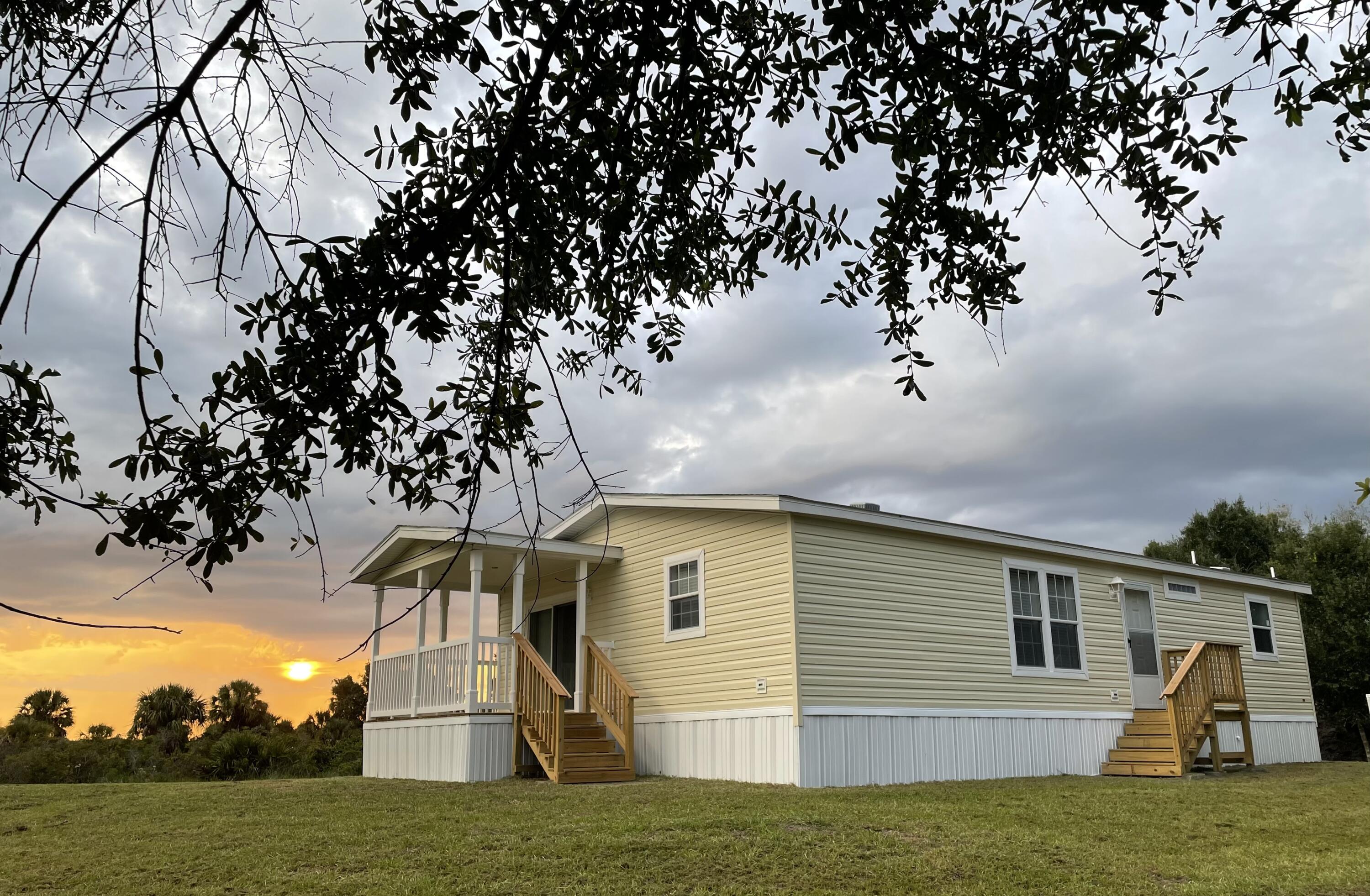 18459 260th Street Okeechobee, FL 34972 - Photo 2 of 15 a view of a house with a yard