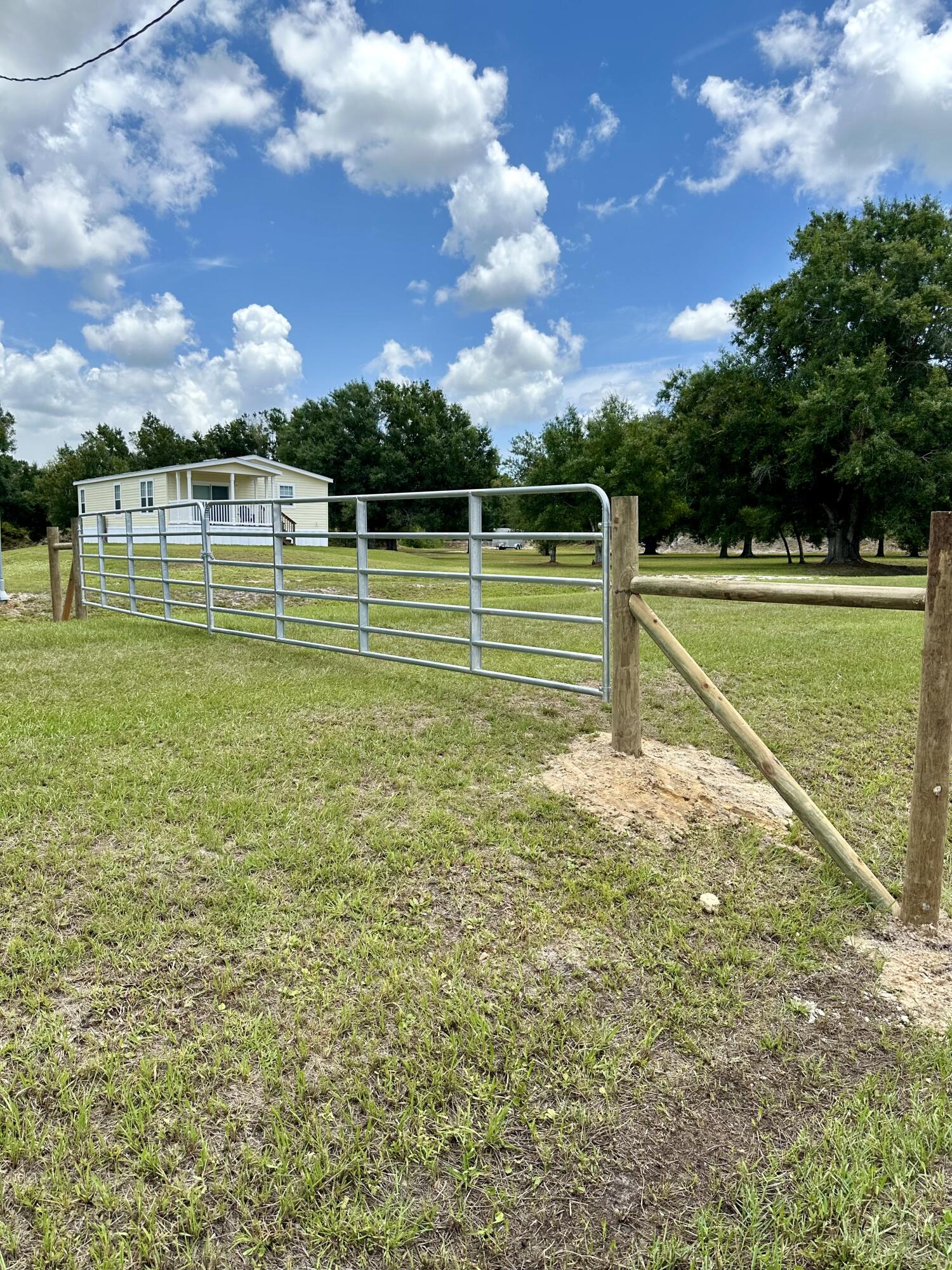 18459 260th Street Okeechobee, FL 34972 - Photo 3 of 15 a view of a golf course with a lake