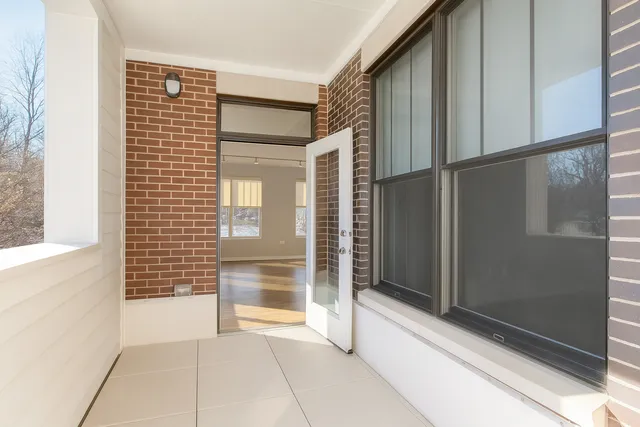 a view of an empty room and a window