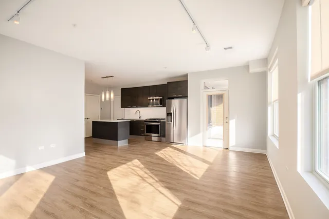 a view of kitchen with furniture and wooden floor