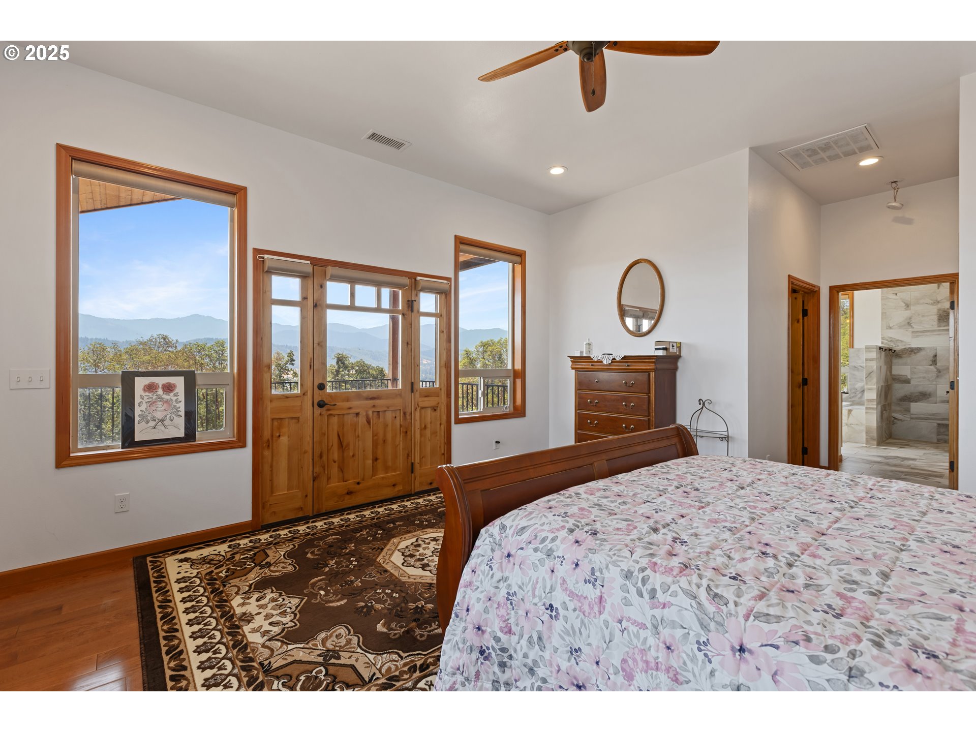 1757 Riddle Bypass Road Riddle, OR 97469 - Photo 13 of 38 a bedroom with a bed and a large window