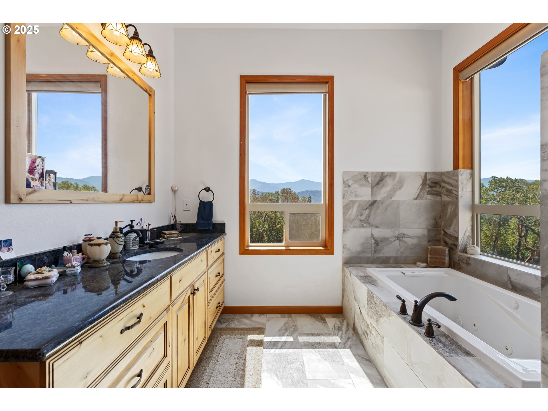 1757 Riddle Bypass Road Riddle, OR 97469 - Photo 16 of 38 a bathroom with a tub sink and mirror