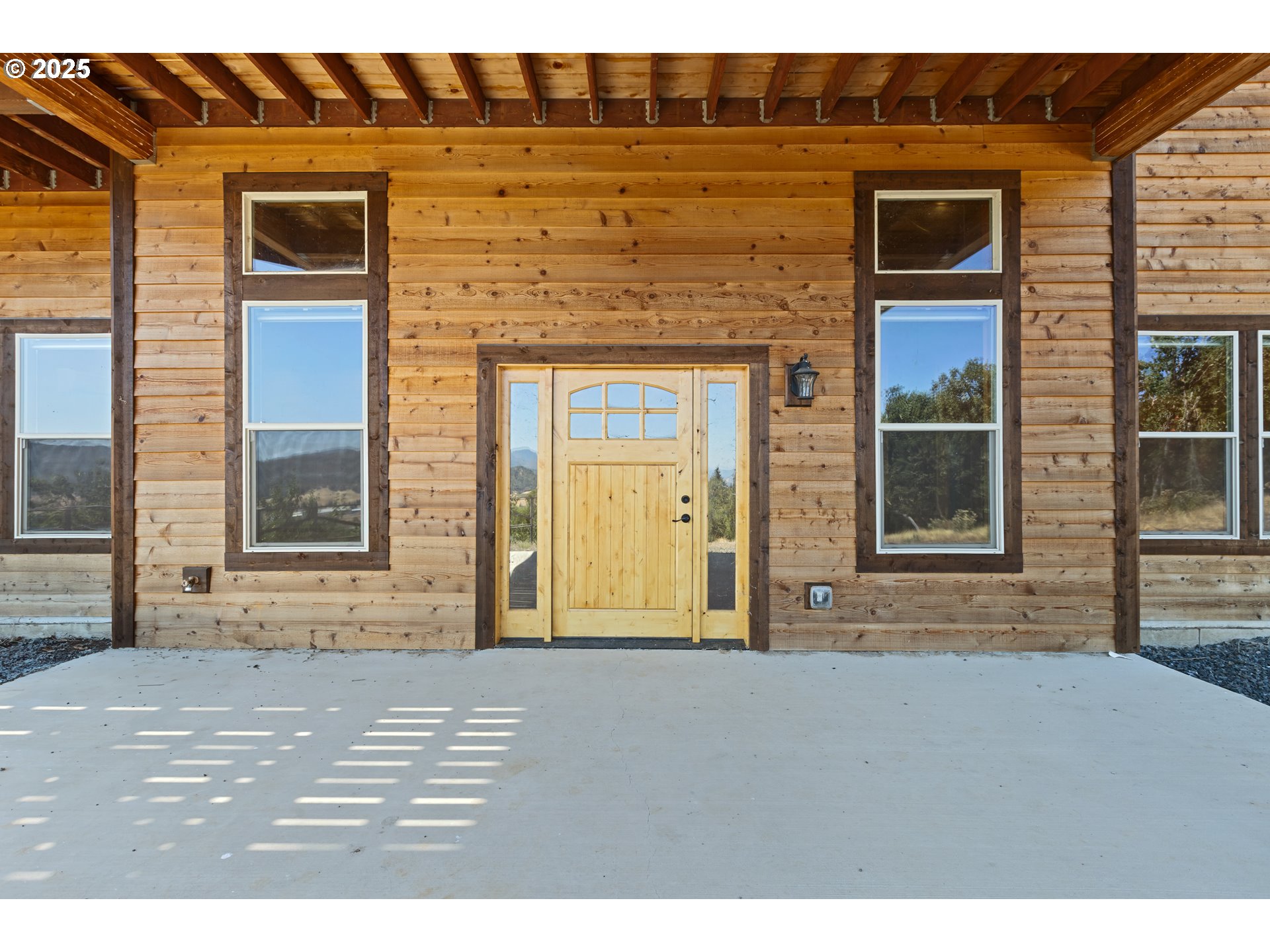 1757 Riddle Bypass Road Riddle, OR 97469 - Photo 19 of 38 a front view of a house with a yard