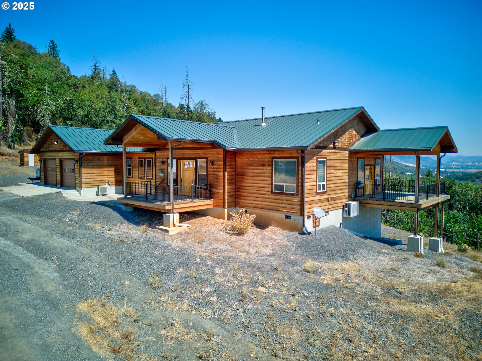 1757 Riddle Bypass Road Riddle, OR 97469 - Photo 2 of 38 a view of a house with a yard porch and sitting area