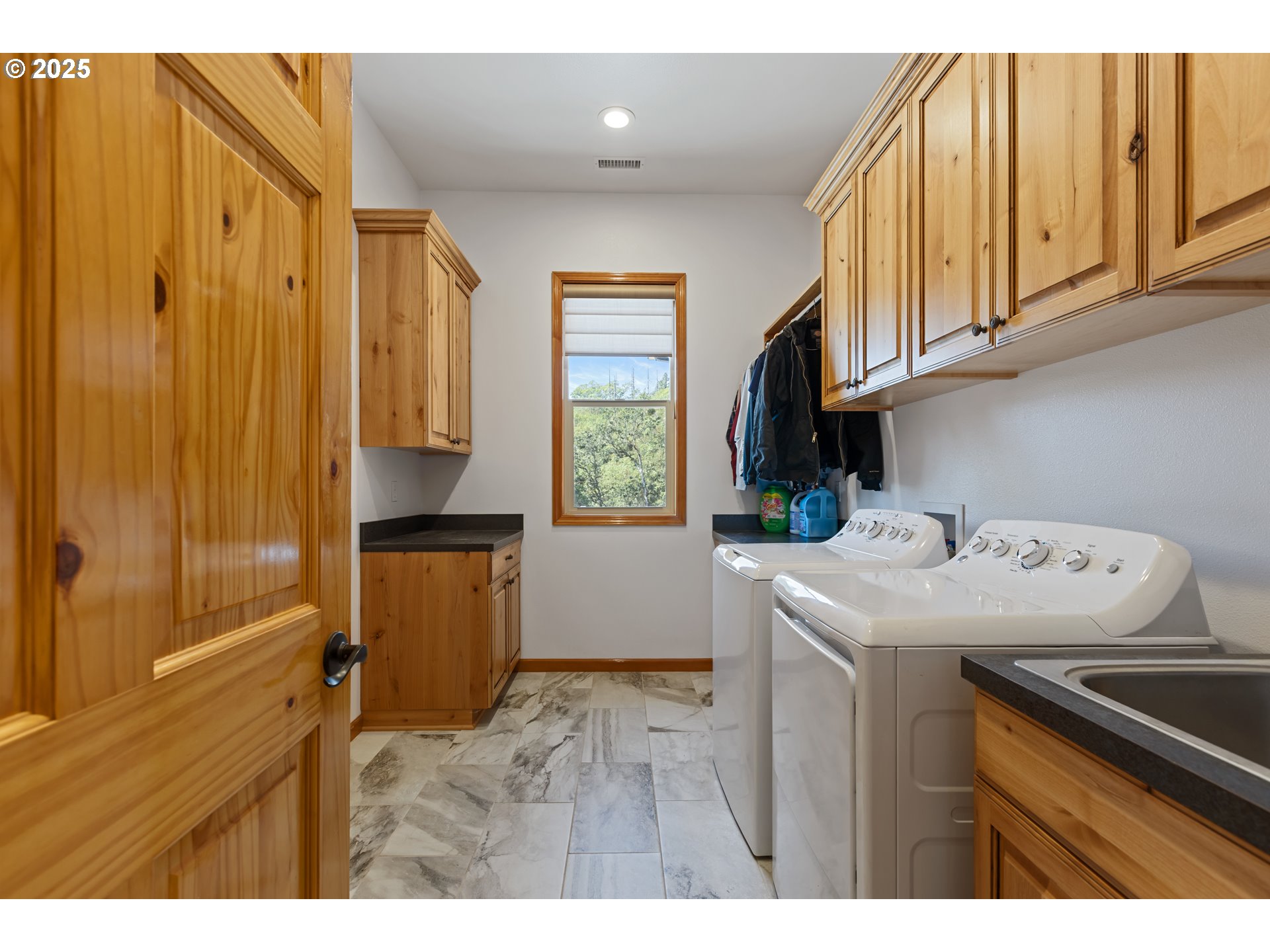 1757 Riddle Bypass Road Riddle, OR 97469 - Photo 26 of 38 a utility room with faucet washer and dryer