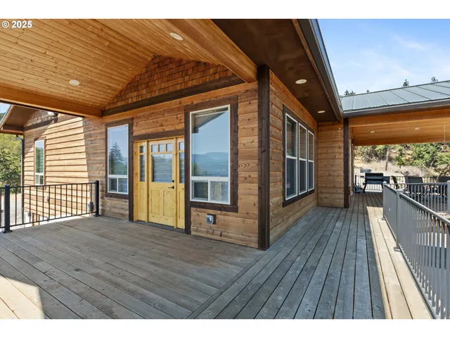 a view of balcony with wooden floor
