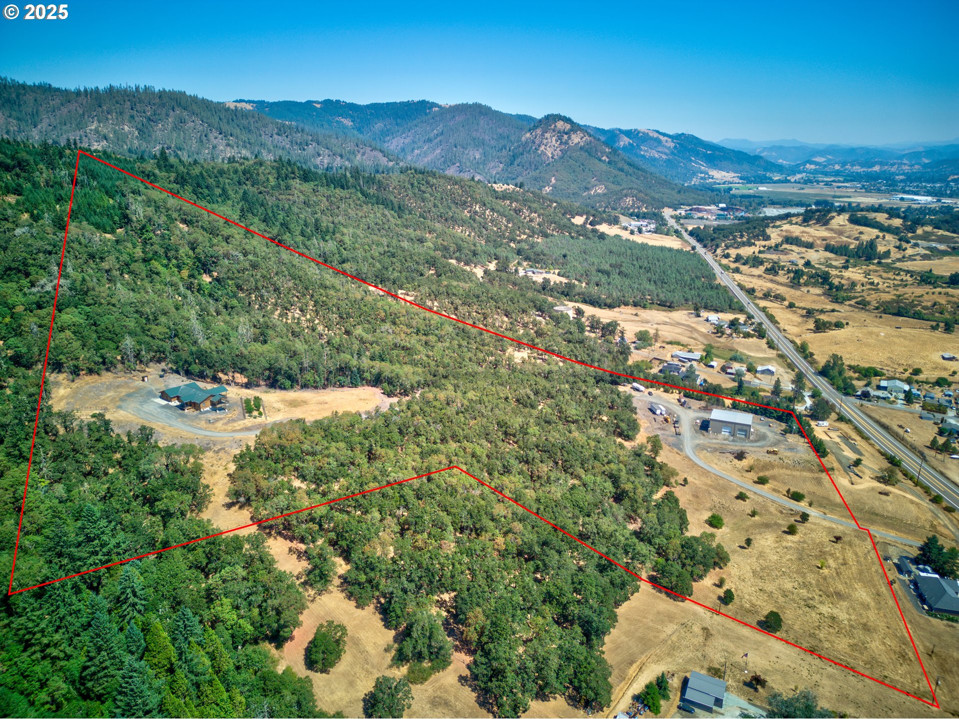 1757 Riddle Bypass Road Riddle, OR 97469 - Photo 31 of 38 an aerial view of residential houses with outdoor space and trees