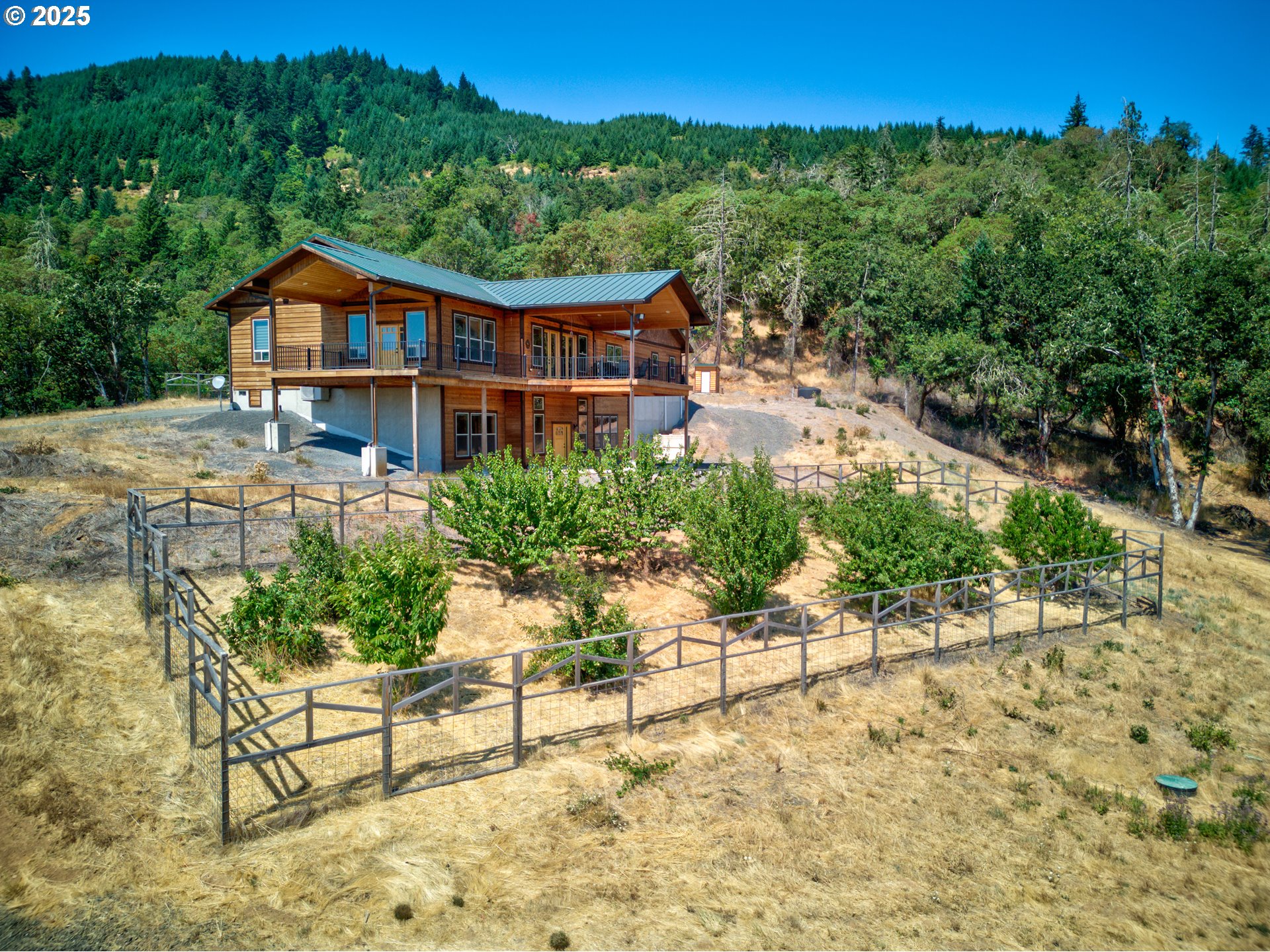 1757 Riddle Bypass Road Riddle, OR 97469 - Photo 34 of 38 a view of a house with a yard and sitting area