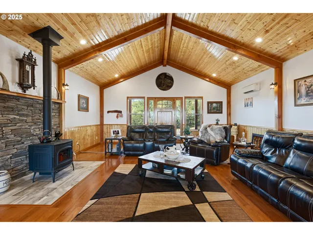 a living room with furniture a rug and a window
