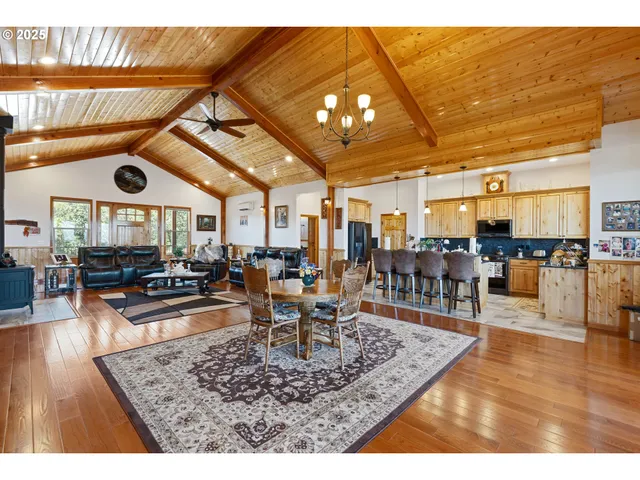 a room with lots of furniture and view of dining room