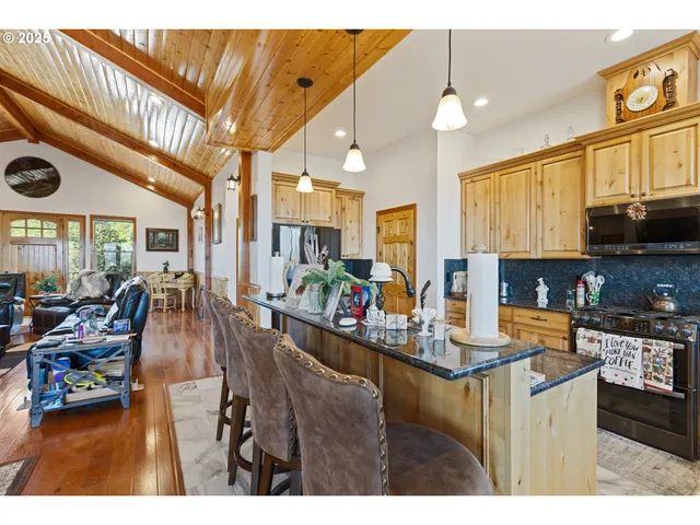 a view of a living room and kitchen