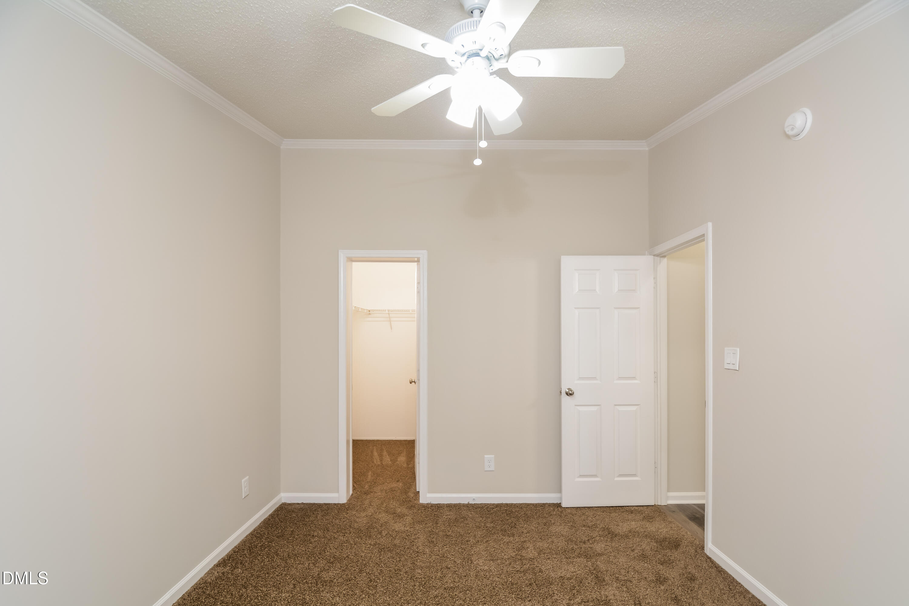 617 East Walnut Avenue Wake Forest, NC 27587 - Photo 14 of 16 an empty room with a ceiling fan and a window