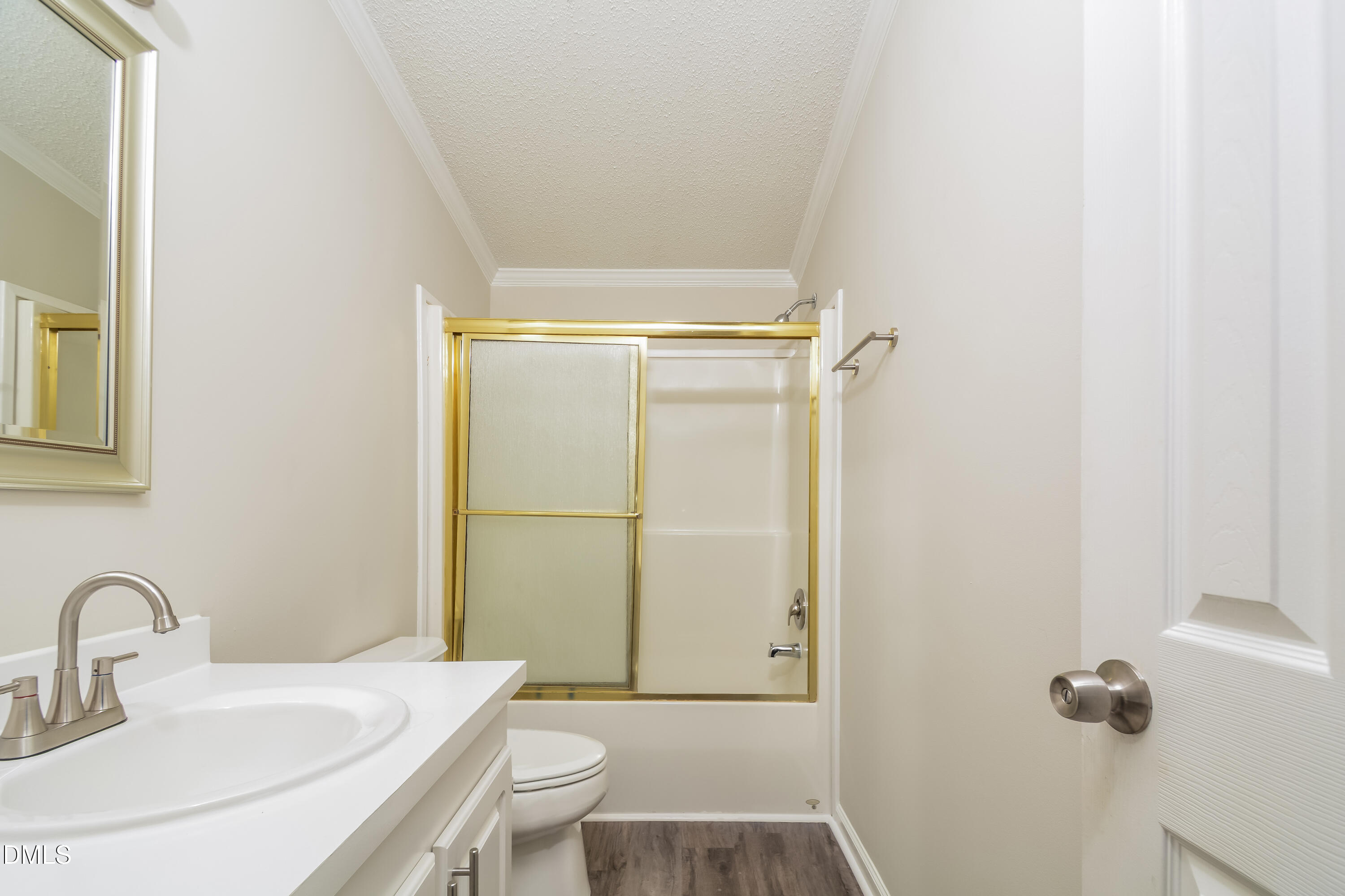 617 East Walnut Avenue Wake Forest, NC 27587 - Photo 15 of 16 a bathroom with a sink toilet and shower