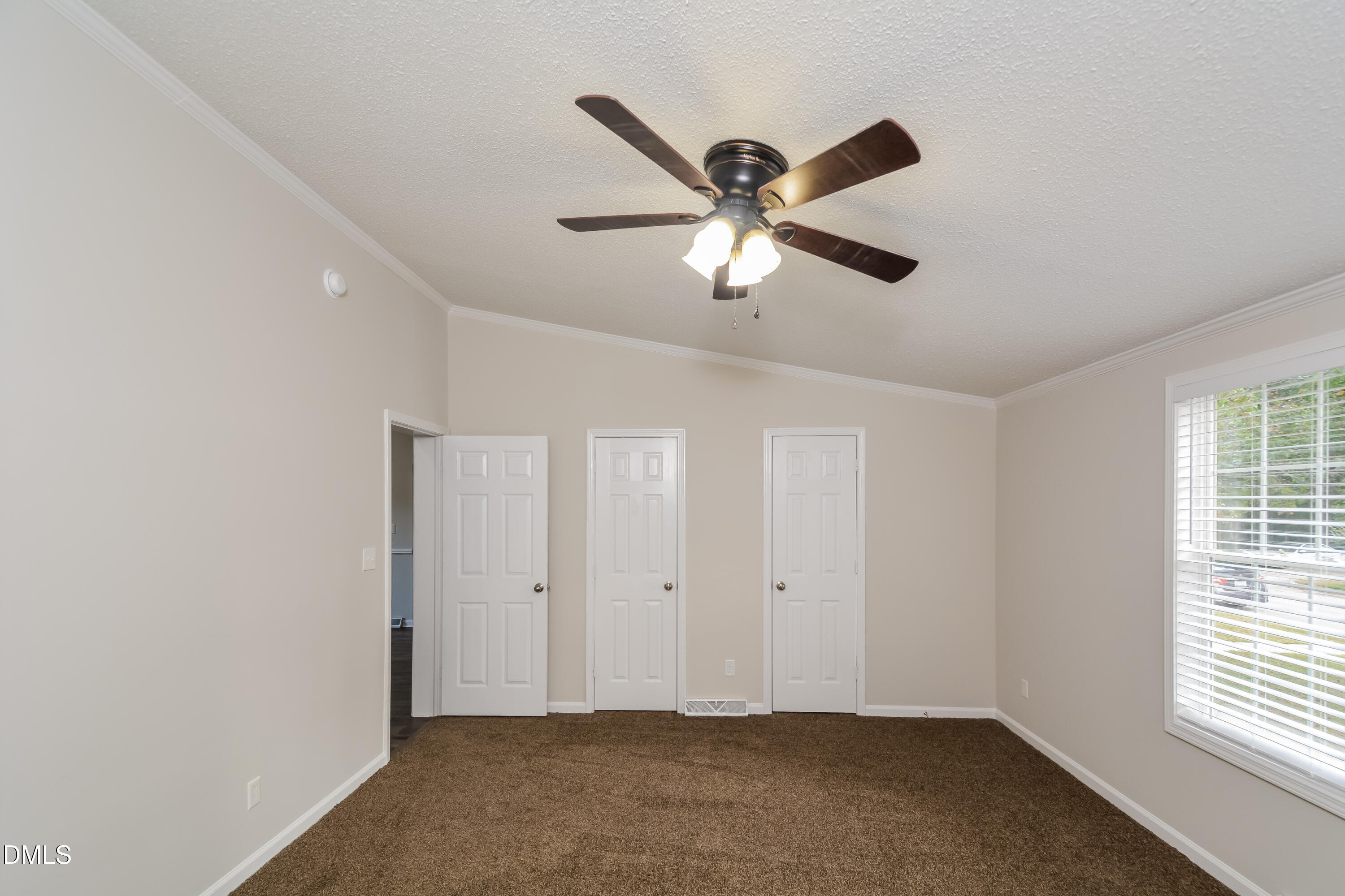 617 East Walnut Avenue Wake Forest, NC 27587 - Photo 7 of 16 wooden floor in an empty room with a window