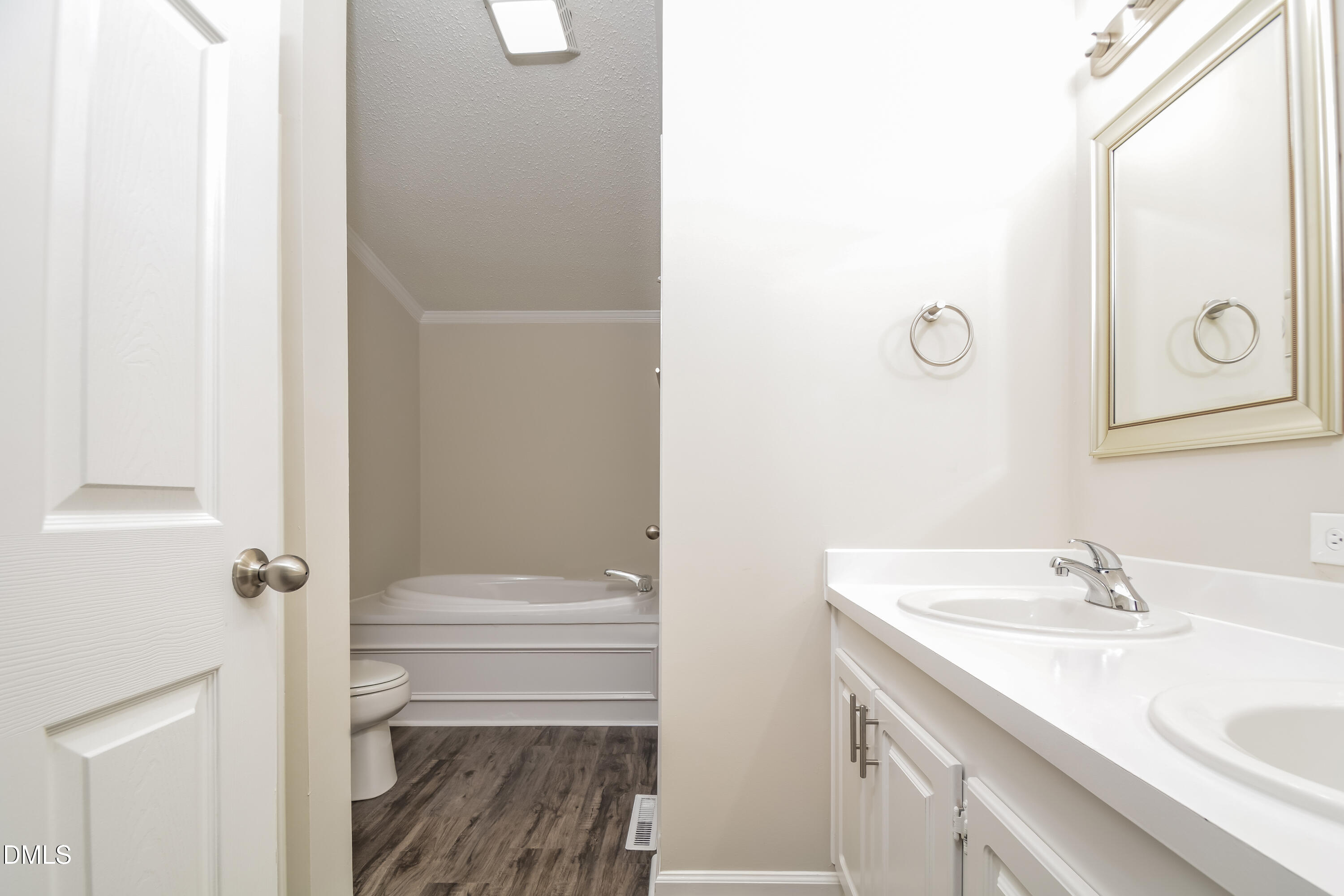 617 East Walnut Avenue Wake Forest, NC 27587 - Photo 9 of 16 a bathroom with a sink and a mirror