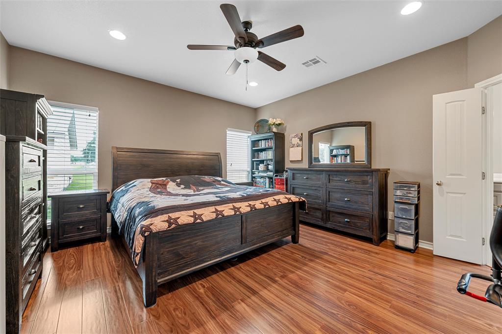 1117 Downsville Road Robinson, TX 76706 - Photo 17 of 40 Spacious room featuring wood-finish flooring, a ceiling fan with integrated lighting, recessed lighting, and a window with blinds