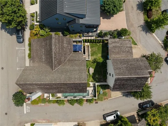 an aerial view of a house with a garden
