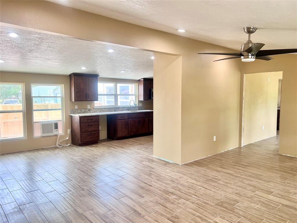 9115 Puritan Way Rosharon, TX 77583 - Photo 6 of 9 a view of a kitchen with a sink and a window