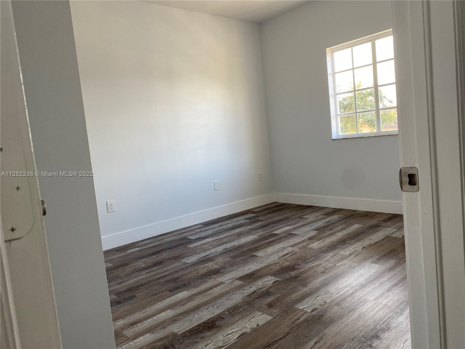 16350 Southwest 50th Terrace Miami, FL 33185 - Photo 27 of 59 an empty room with a window