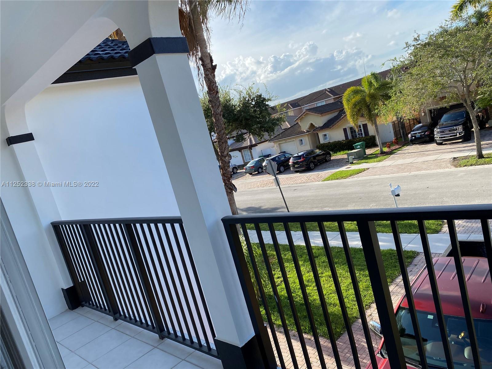 16350 Southwest 50th Terrace Miami, FL 33185 - Photo 32 of 59 a view of balcony with wooden floor