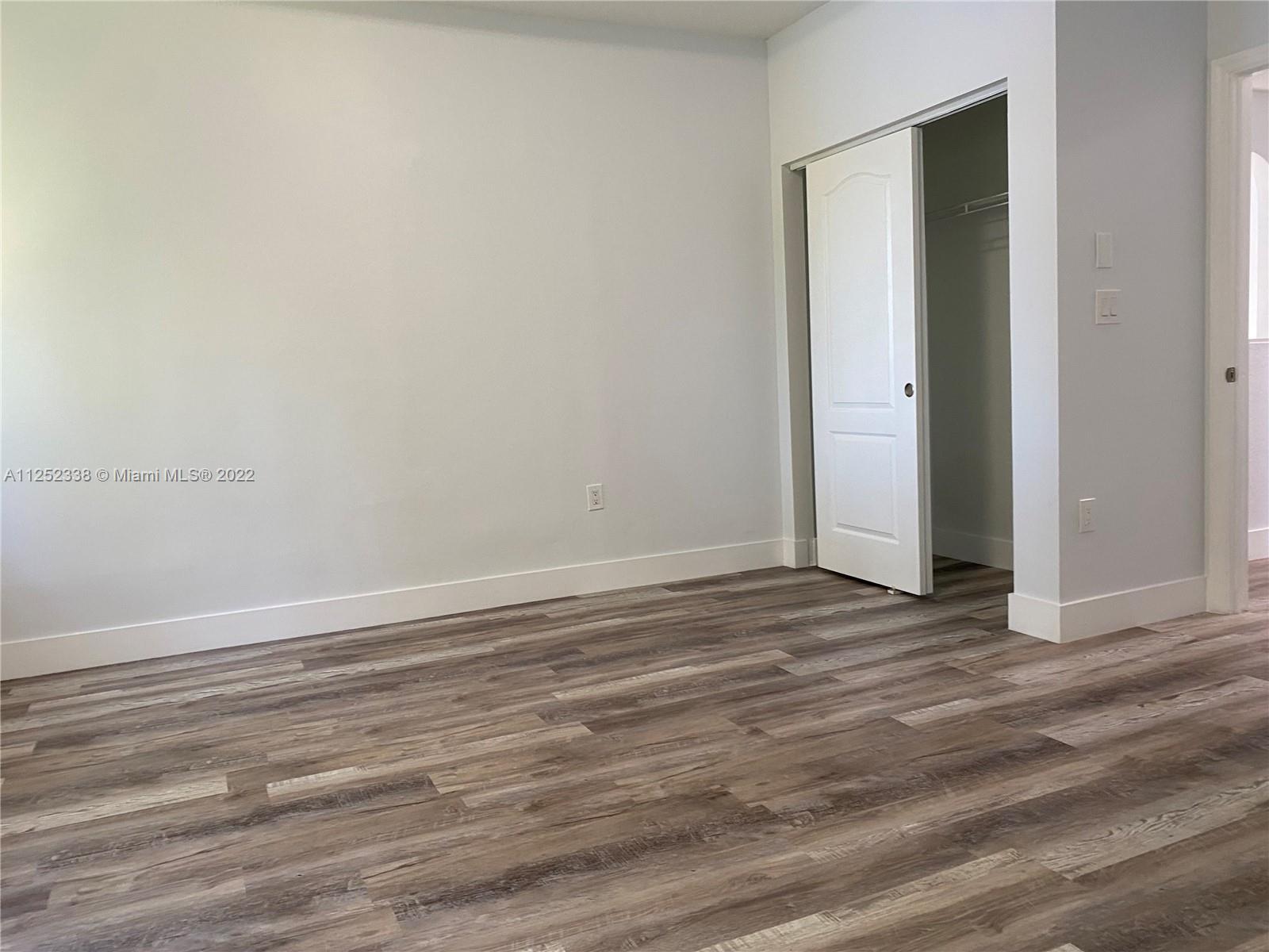16350 Southwest 50th Terrace Miami, FL 33185 - Photo 42 of 59 a view of a room with wooden floor and closet