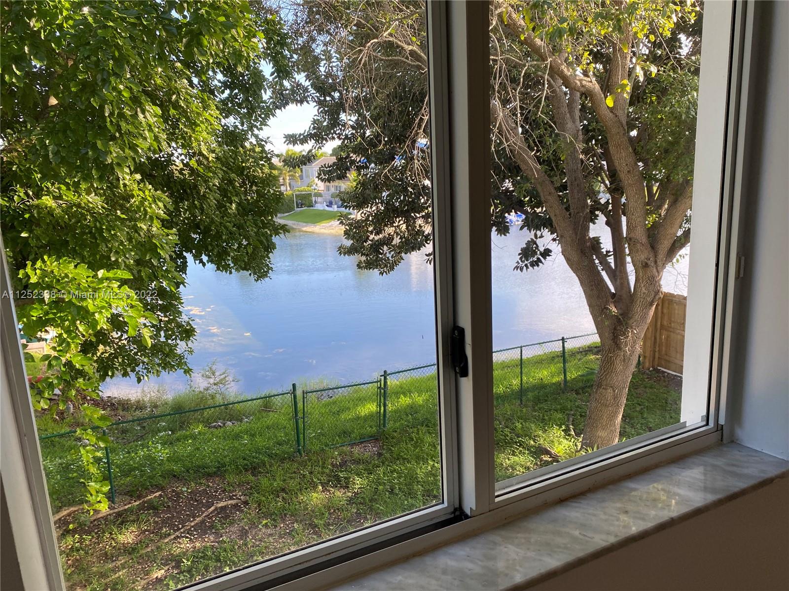16350 Southwest 50th Terrace Miami, FL 33185 - Photo 44 of 59 a view of a yard from a window