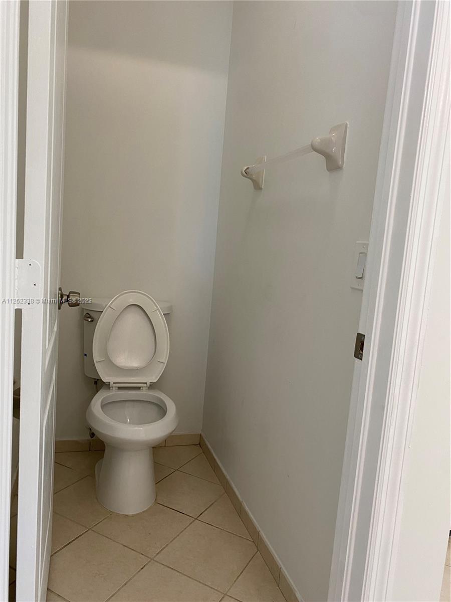 16350 Southwest 50th Terrace Miami, FL 33185 - Photo 48 of 59 a white toilet sitting next to a shower