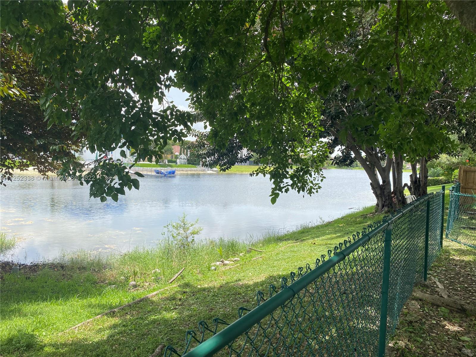16350 Southwest 50th Terrace Miami, FL 33185 - Photo 55 of 59 a view of a garden from a lake