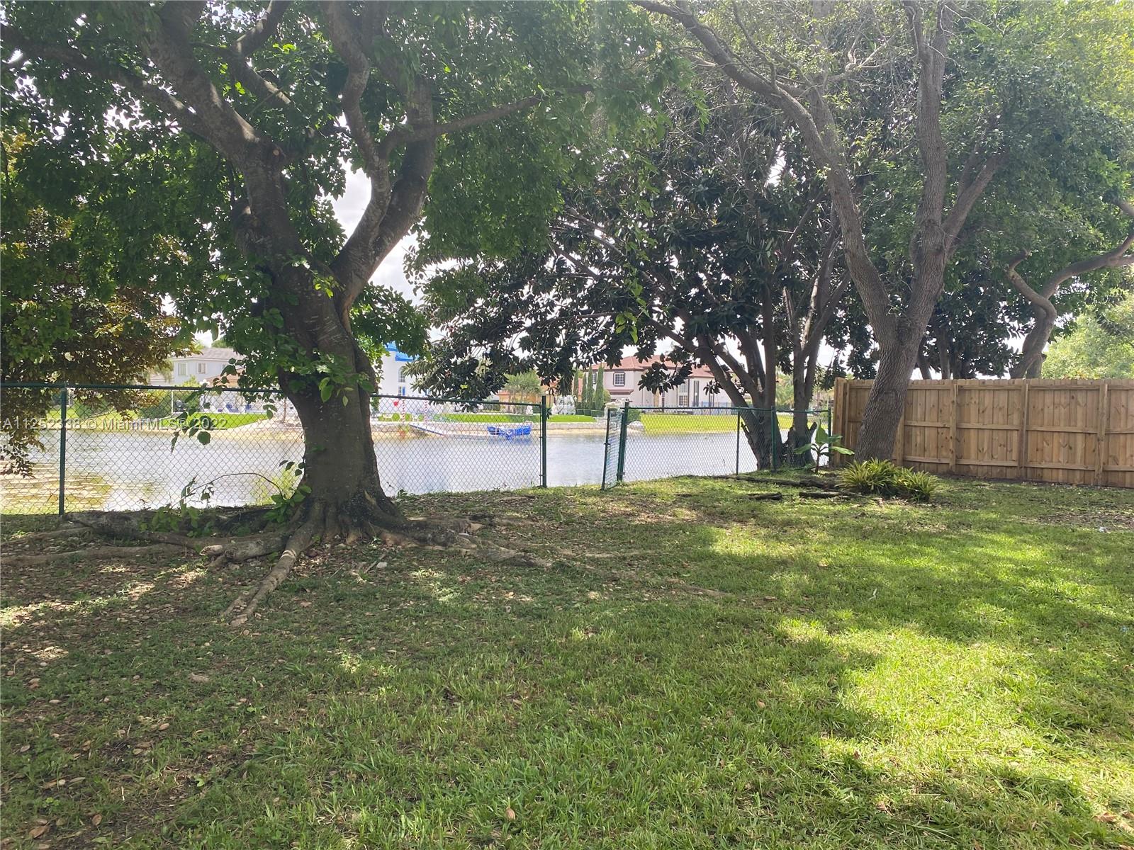 16350 Southwest 50th Terrace Miami, FL 33185 - Photo 57 of 59 a view of yard with tree and trees