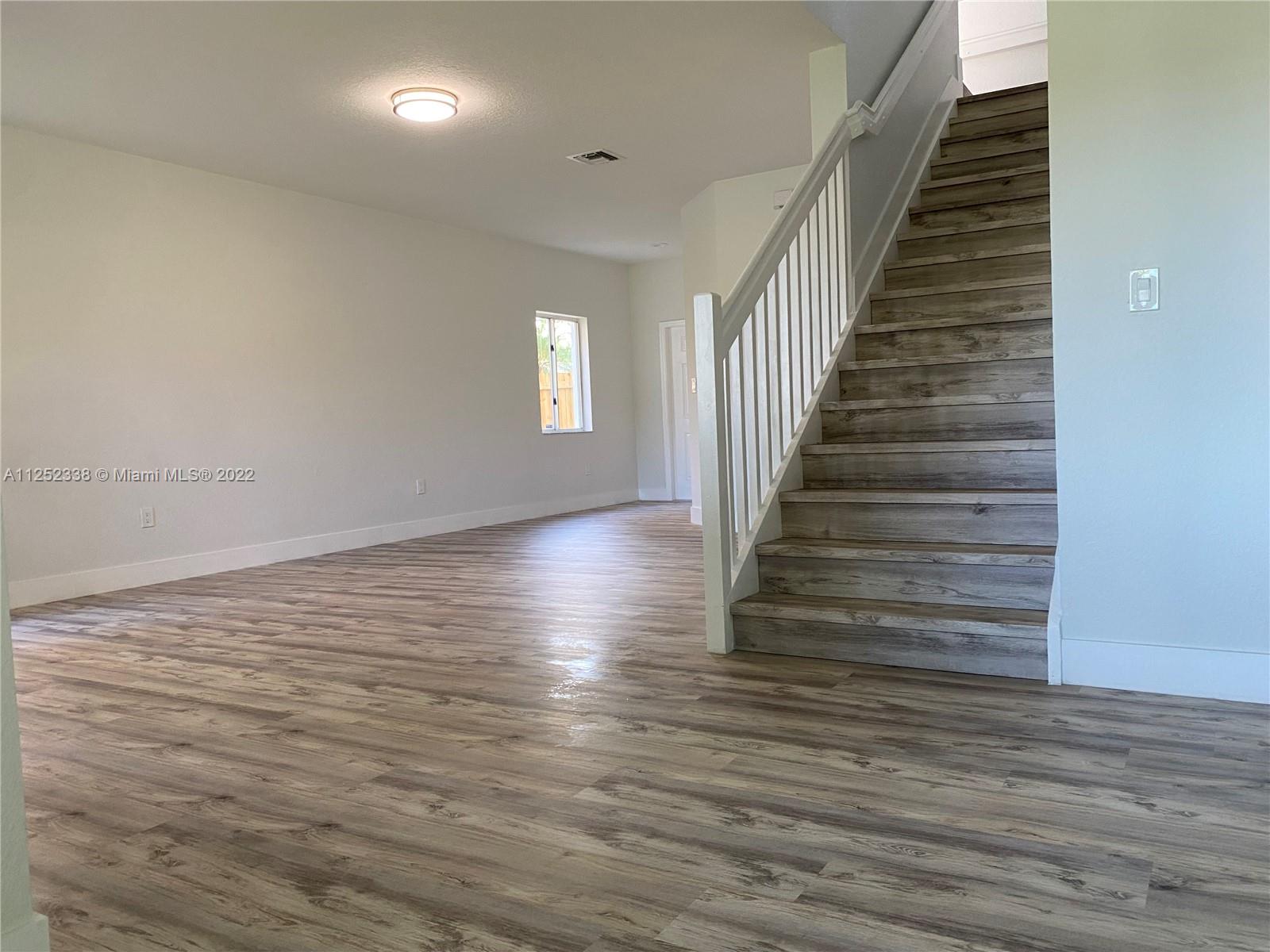 16350 Southwest 50th Terrace Miami, FL 33185 - Photo 8 of 59 a view of entryway and hall with wooden floor