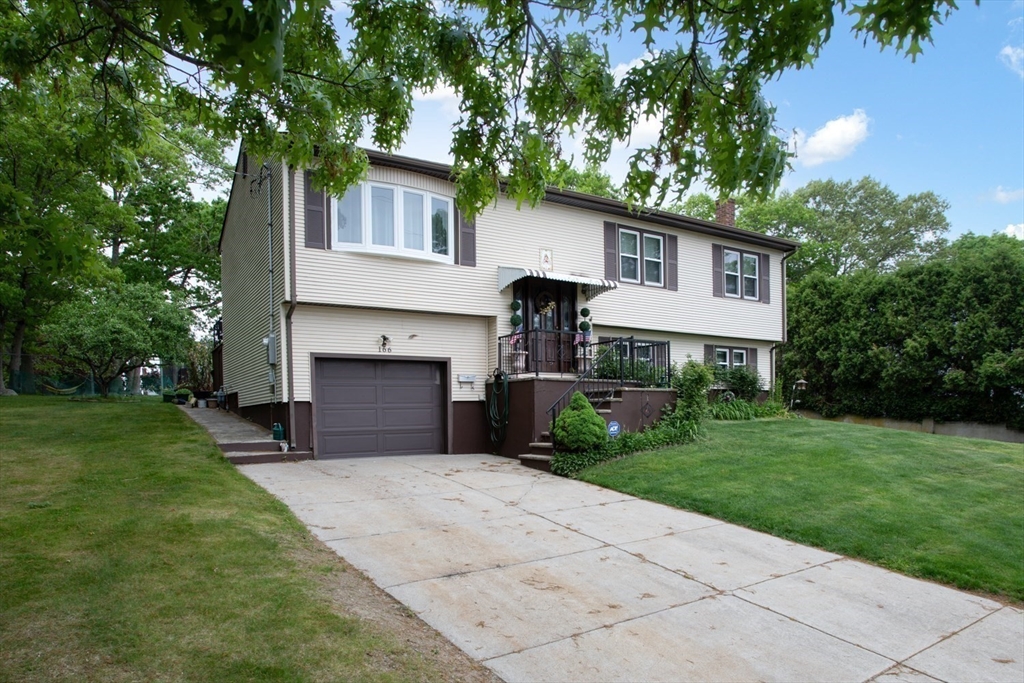 166 Stonehaven Road Fall River, MA 02723 - Photo 27 of 33 a front view of a house with a garden and trees