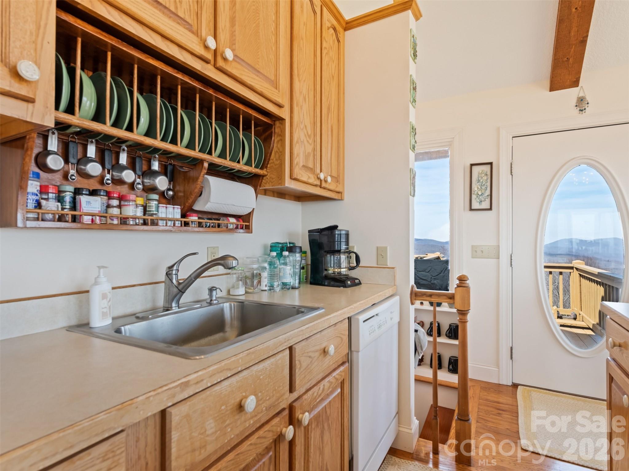 1007 Turkey Trot Road Clyde, NC 28721 - Photo 12 of 48 a kitchen with stainless steel appliances a sink and a refrigerator