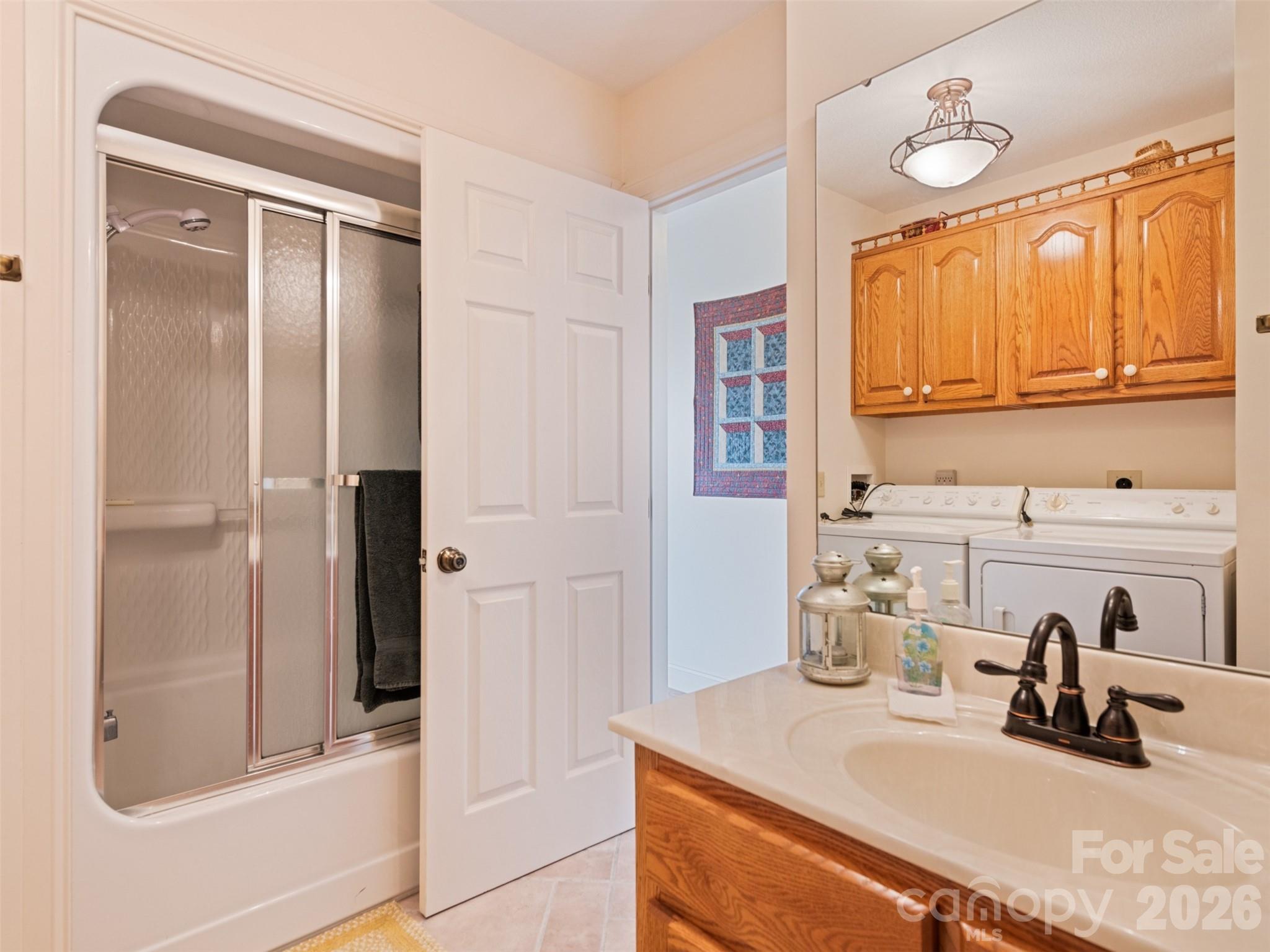 1007 Turkey Trot Road Clyde, NC 28721 - Photo 25 of 48 a bathroom with a sink and a mirror