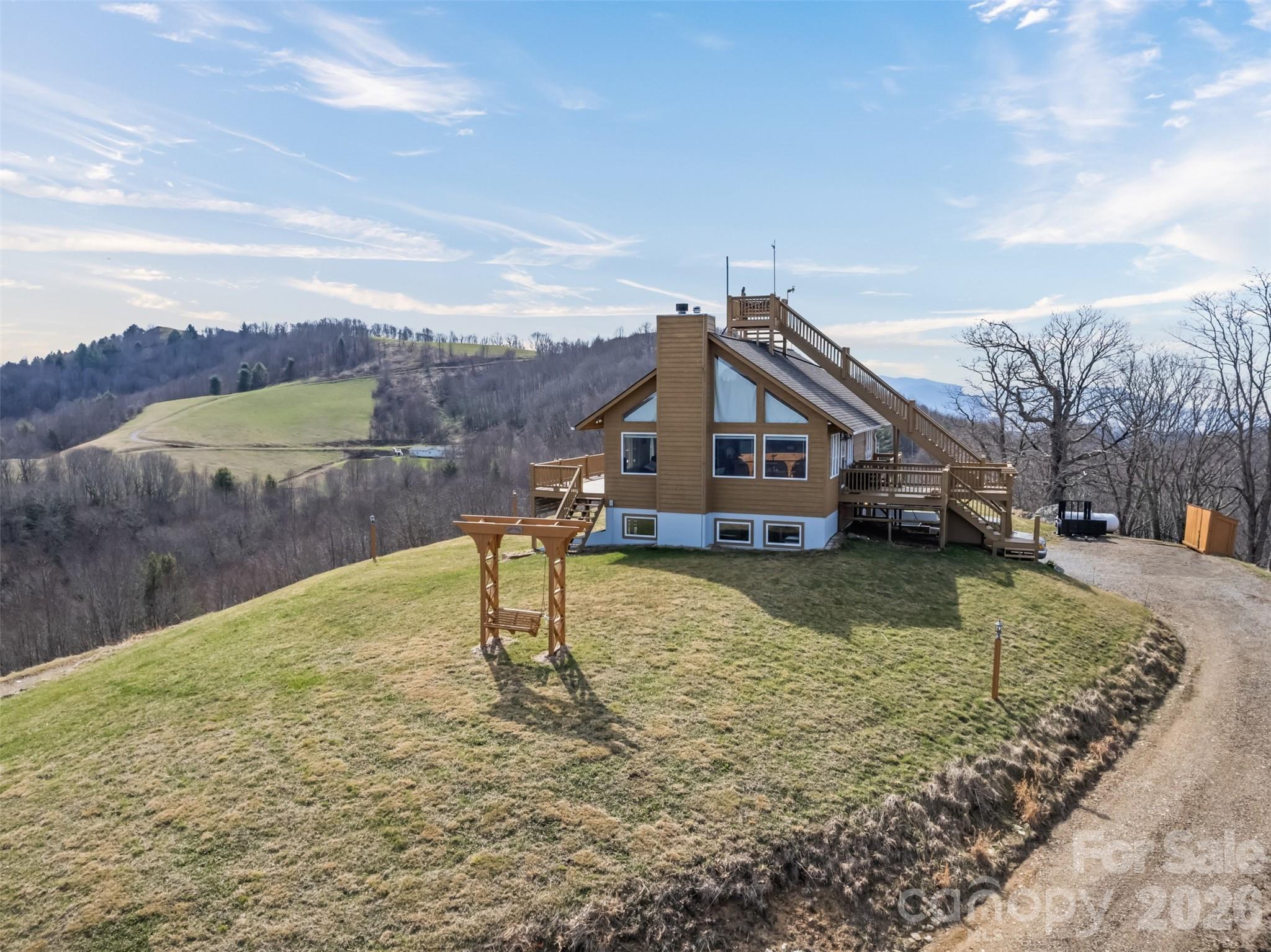 1007 Turkey Trot Road Clyde, NC 28721 - Photo 40 of 48 a house view with a lake view