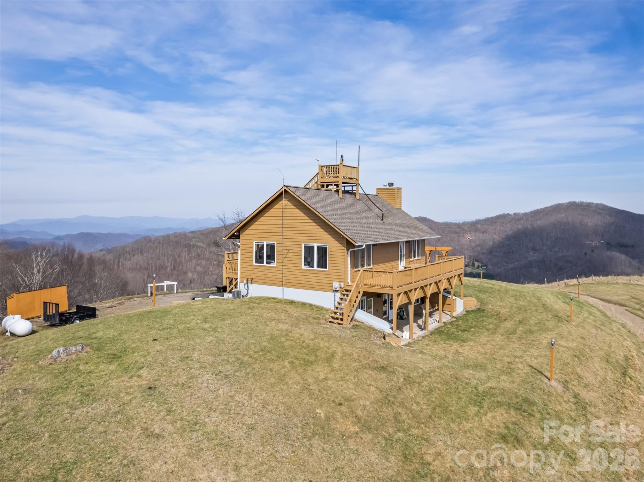 1007 Turkey Trot Road Clyde, NC 28721 - Photo 4 of 48 an aerial view of a house with a yard