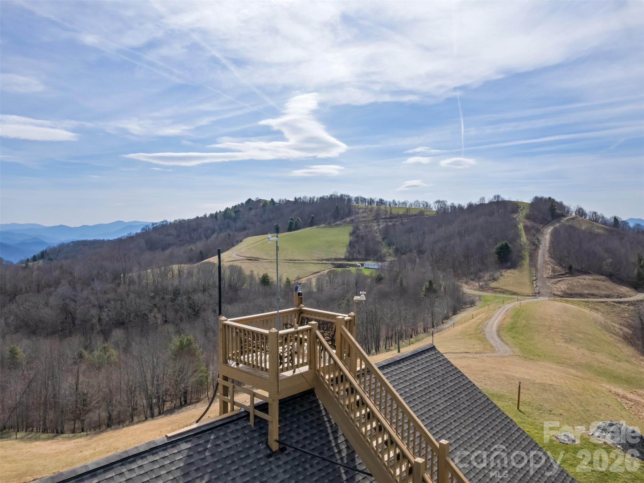1007 Turkey Trot Road Clyde, NC 28721 - Photo 43 of 48 a view of a balcony with two chairs and a table