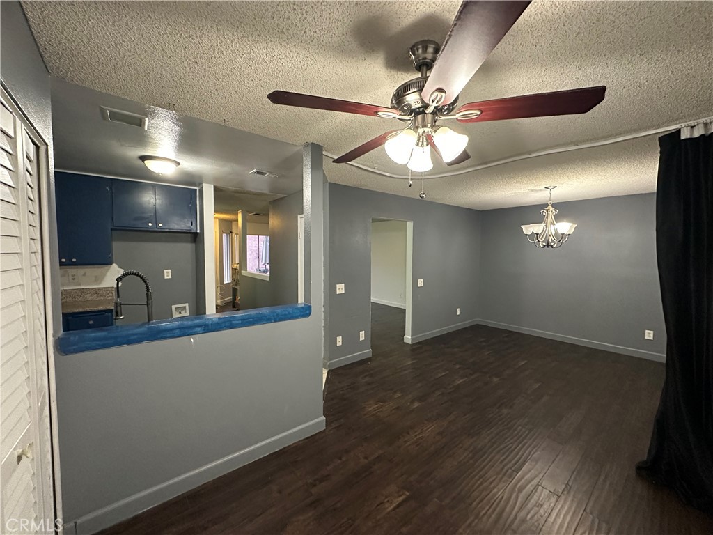 165 Racquet Club Drive Compton, CA 90220 - Photo 11 of 47 a view of a livingroom with a chandelier